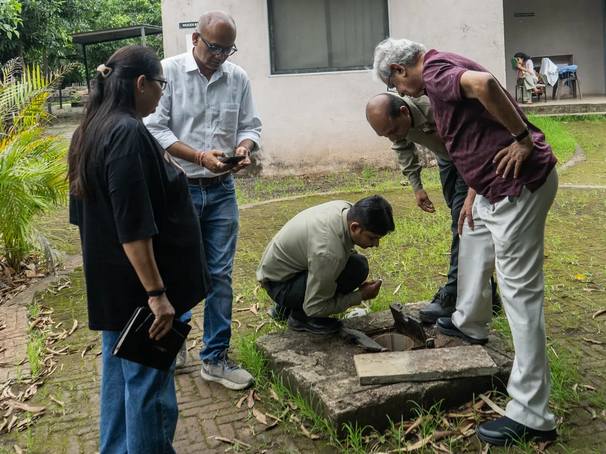 Sujalaam team inspecting an existing well at a site