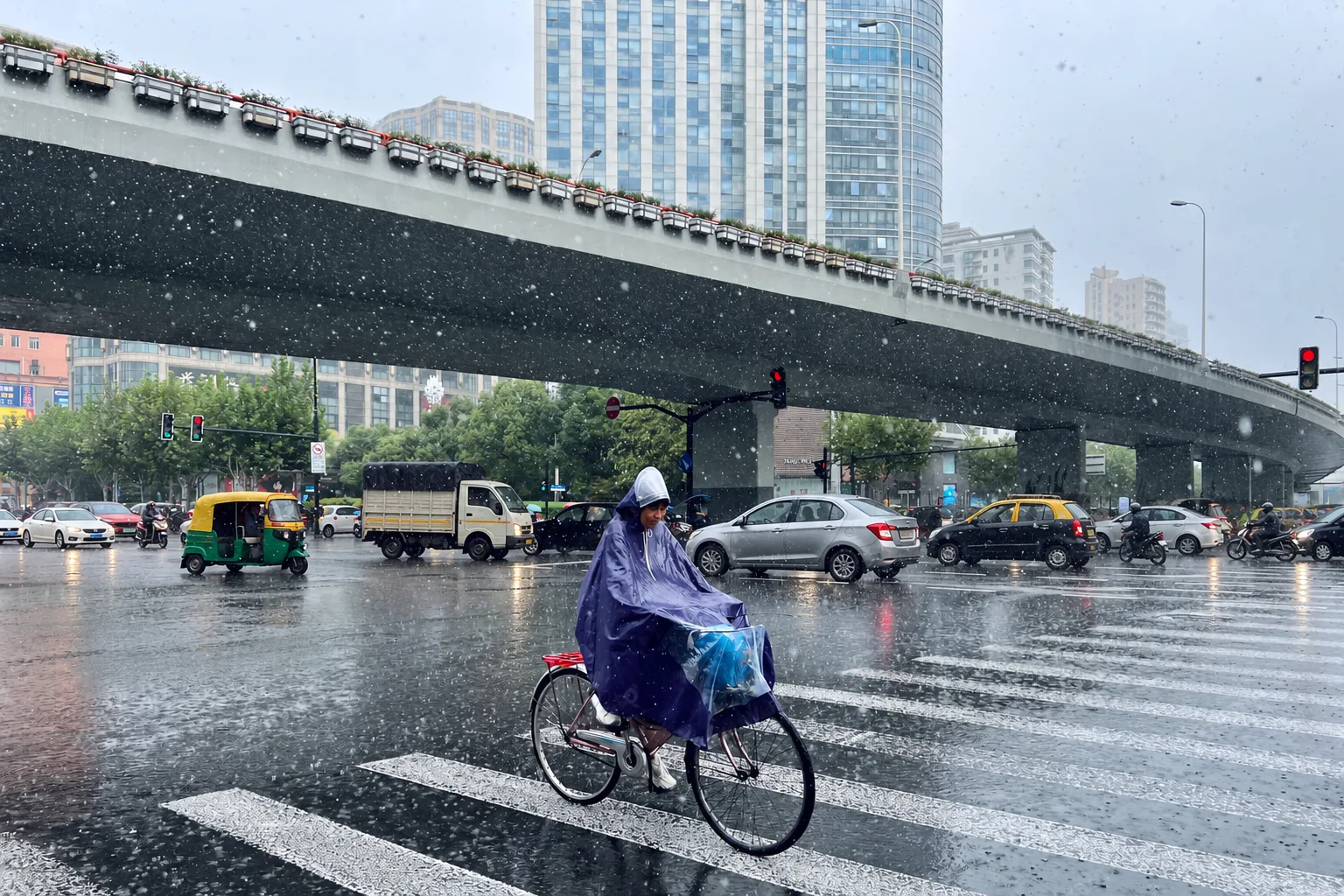 Commuting through the monsoon rain on a city street